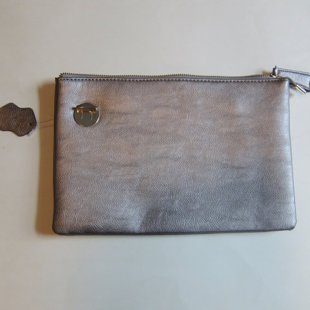 Grey leather clutch bag with tag still attached.